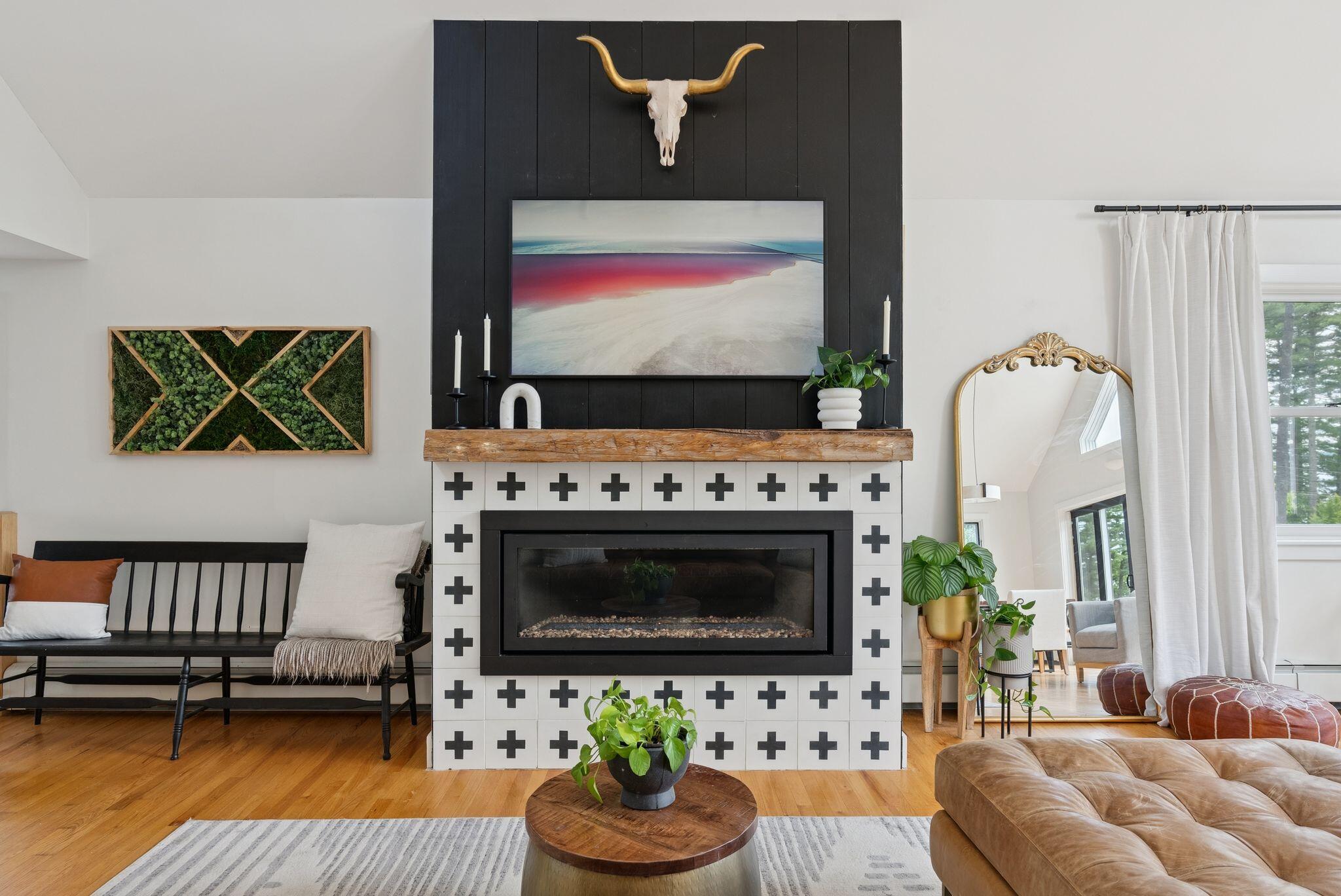 Fireplace with statement longhorn skull and moss art